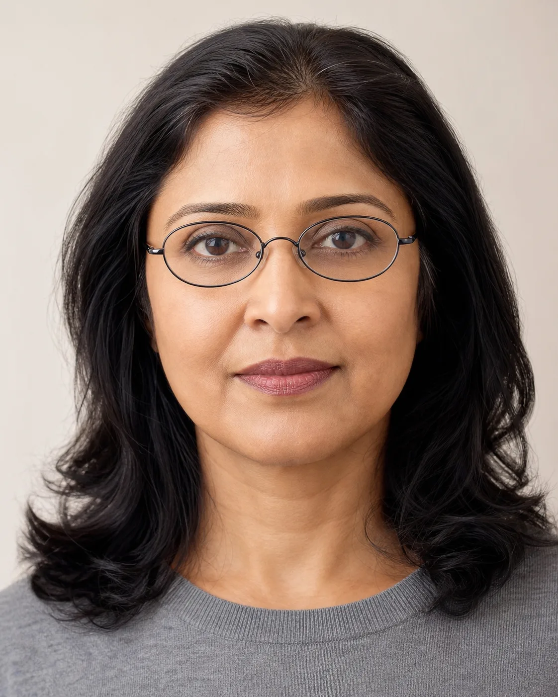 Model wearing oval glasses, front view